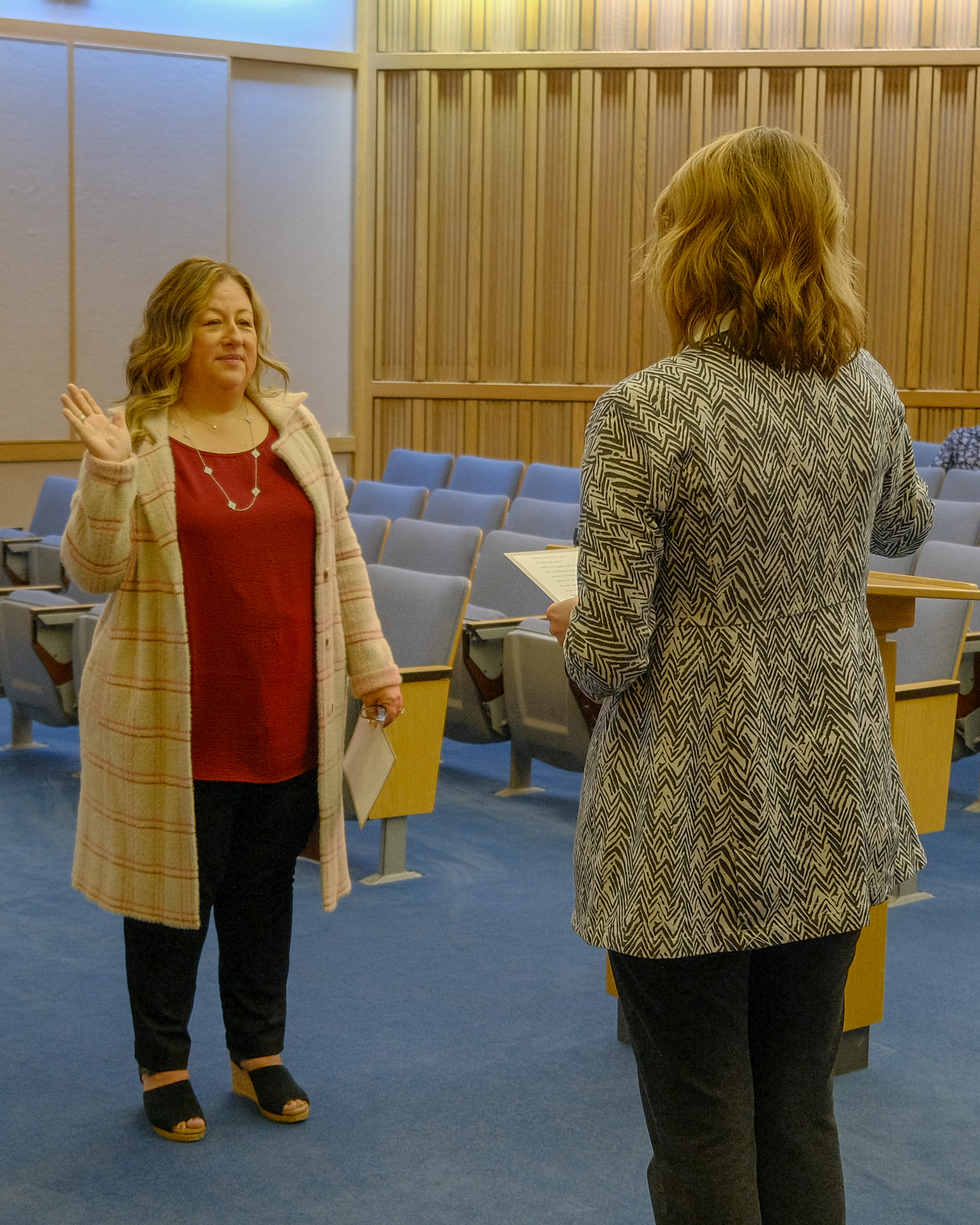 Director Becky Hackler Arellano takes oath of office.